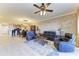 Open concept living space with hardwood floors and a view into the kitchen at 87 Vivante Blvd # 403, Punta Gorda, FL 33950