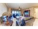Spacious living room with ocean views, leather furniture, and hardwood floors at 87 Vivante Blvd # 403, Punta Gorda, FL 33950