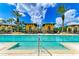 Lap pool with two lanes and surrounding lounge chairs at 87 Vivante Blvd # 403, Punta Gorda, FL 33950