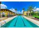 Long lap pool with surrounding lounge chairs at 87 Vivante Blvd # 403, Punta Gorda, FL 33950