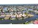 Aerial view highlighting the property's waterfront location at 951 Santa Brigida Ct, Punta Gorda, FL 33950