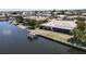 Aerial view of waterfront home with private dock and boat lift at 951 Santa Brigida Ct, Punta Gorda, FL 33950