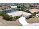 Bird's-eye view of single-story home with circular driveway and canal access at 951 Santa Brigida Ct, Punta Gorda, FL 33950