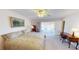 Primary bedroom with direct access to patio and water views at 951 Santa Brigida Ct, Punta Gorda, FL 33950
