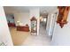 Bright entryway with tile floors and wood furniture at 951 Santa Brigida Ct, Punta Gorda, FL 33950
