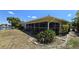 Exterior view of the home showcasing a screened patio and canal view at 951 Santa Brigida Ct, Punta Gorda, FL 33950