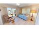 Bright guest room with water views, daybed, and comfortable armchair at 951 Santa Brigida Ct, Punta Gorda, FL 33950