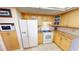 Well-equipped kitchen with granite counters and white appliances at 951 Santa Brigida Ct, Punta Gorda, FL 33950