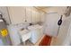 Bright laundry room with washer, dryer, and utility sink at 951 Santa Brigida Ct, Punta Gorda, FL 33950