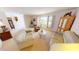 Living room with light leather sofas and a wooden cabinet at 951 Santa Brigida Ct, Punta Gorda, FL 33950