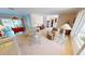 Spacious living room with light leather furniture and large windows at 951 Santa Brigida Ct, Punta Gorda, FL 33950