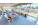 Spacious screened porch with water views and seating area at 951 Santa Brigida Ct, Punta Gorda, FL 33950