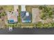Aerial view of two homes with pools near the water at 9516 President Cir, Port Charlotte, FL 33981