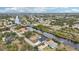 Aerial view of waterfront community with homes and canals at 9516 President Cir, Port Charlotte, FL 33981