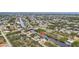 Aerial view showcasing a house's location in a waterfront community at 9516 President Cir, Port Charlotte, FL 33981
