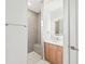 Modern bathroom with a walk-in shower and floating vanity at 9516 President Cir, Port Charlotte, FL 33981
