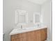 Elegant bathroom with double vanity and quartz countertops at 9516 President Cir, Port Charlotte, FL 33981