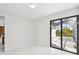 Bright bedroom with sliding doors and a view of the water at 9516 President Cir, Port Charlotte, FL 33981