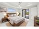 Spacious bedroom with wood platform bed and patio access at 9516 President Cir, Port Charlotte, FL 33981