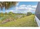 Peaceful backyard with lush canal-side landscaping at 9516 President Cir, Port Charlotte, FL 33981