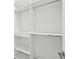 Large walk-in closet with shelves and hanging rods at 9516 President Cir, Port Charlotte, FL 33981