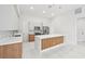 Modern kitchen with wood cabinets and quartz countertops at 9516 President Cir, Port Charlotte, FL 33981