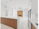Modern kitchen with island overlooking living room at 9516 President Cir, Port Charlotte, FL 33981
