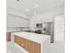 Modern kitchen with stainless steel appliances and quartz countertops at 9516 President Cir, Port Charlotte, FL 33981