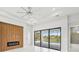 Living room with fireplace, sliding glass doors to pool area at 9516 President Cir, Port Charlotte, FL 33981