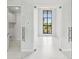 Bright office space with glass doors and large window at 9516 President Cir, Port Charlotte, FL 33981