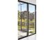 View of backyard through sliding glass doors at 9516 President Cir, Port Charlotte, FL 33981