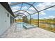 Relaxing screened pool and spa with water views at 9516 President Cir, Port Charlotte, FL 33981