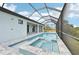 Large pool and spa with screened enclosure and patio at 9516 President Cir, Port Charlotte, FL 33981
