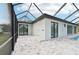 Modern pool area with screened enclosure and canal view at 9516 President Cir, Port Charlotte, FL 33981