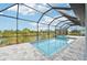 Luxury screened pool and spa with tranquil views at 9516 President Cir, Port Charlotte, FL 33981