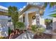 Welcoming front entrance with lush landscaping and a charming wreath at 10 Windward Ct, Placida, FL 33946