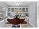 Bright eat-in kitchen with white cabinets and granite countertops at 10 Windward Ct, Placida, FL 33946