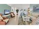 Relaxing living room featuring wicker chairs and a neutral color scheme at 10 Windward Ct, Placida, FL 33946