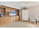 Living room with built-in shelving, a TV, and a cabinet at 10 Windward Ct, Placida, FL 33946