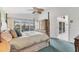 Spacious main bedroom with a king-size bed and access to the bathroom at 10 Windward Ct, Placida, FL 33946