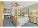 Main bedroom with a large four poster bed and access to a balcony at 10 Windward Ct, Placida, FL 33946