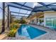 Refreshing pool with screened enclosure and patio at 10 Windward Ct, Placida, FL 33946