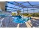 Large screened pool with patio and lounge chairs at 10 Windward Ct, Placida, FL 33946