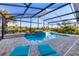 Screened pool and patio with lounge chairs at 10 Windward Ct, Placida, FL 33946