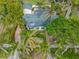 Aerial view of a single-Gathering home with a green roof and palm trees at 110 Chasteen St, Punta Gorda, FL 33950