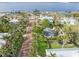 Aerial view of a residential street with lush landscaping and waterfront access at 110 Chasteen St, Punta Gorda, FL 33950