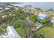 Aerial view of a neighborhood with waterfront access and tropical landscaping at 110 Chasteen St, Punta Gorda, FL 33950