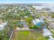 Aerial view of a single-Gathering home with a spacious yard and water views at 110 Chasteen St, Punta Gorda, FL 33950