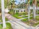 Single story home with green roof and palm trees at 110 Chasteen St, Punta Gorda, FL 33950