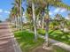 Residential street lined with palm trees and homes at 110 Chasteen St, Punta Gorda, FL 33950